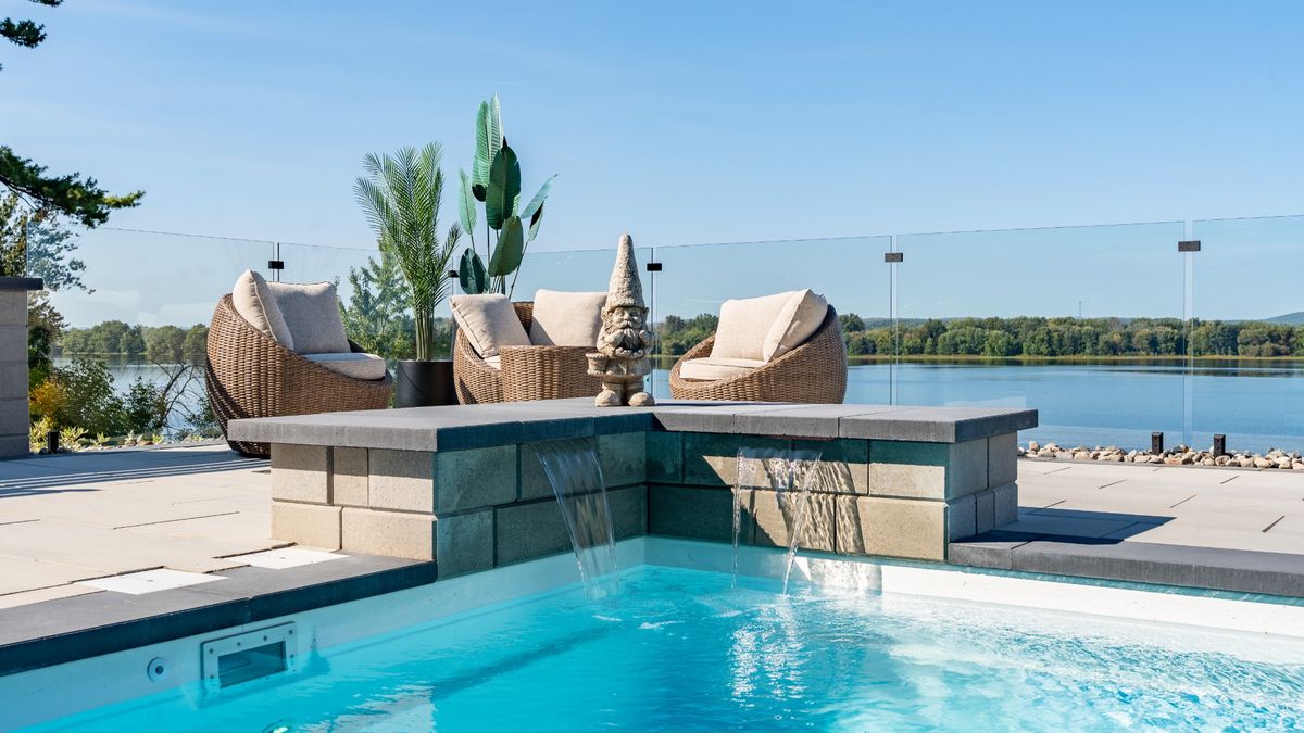 Pool and raised lounge area with lake view