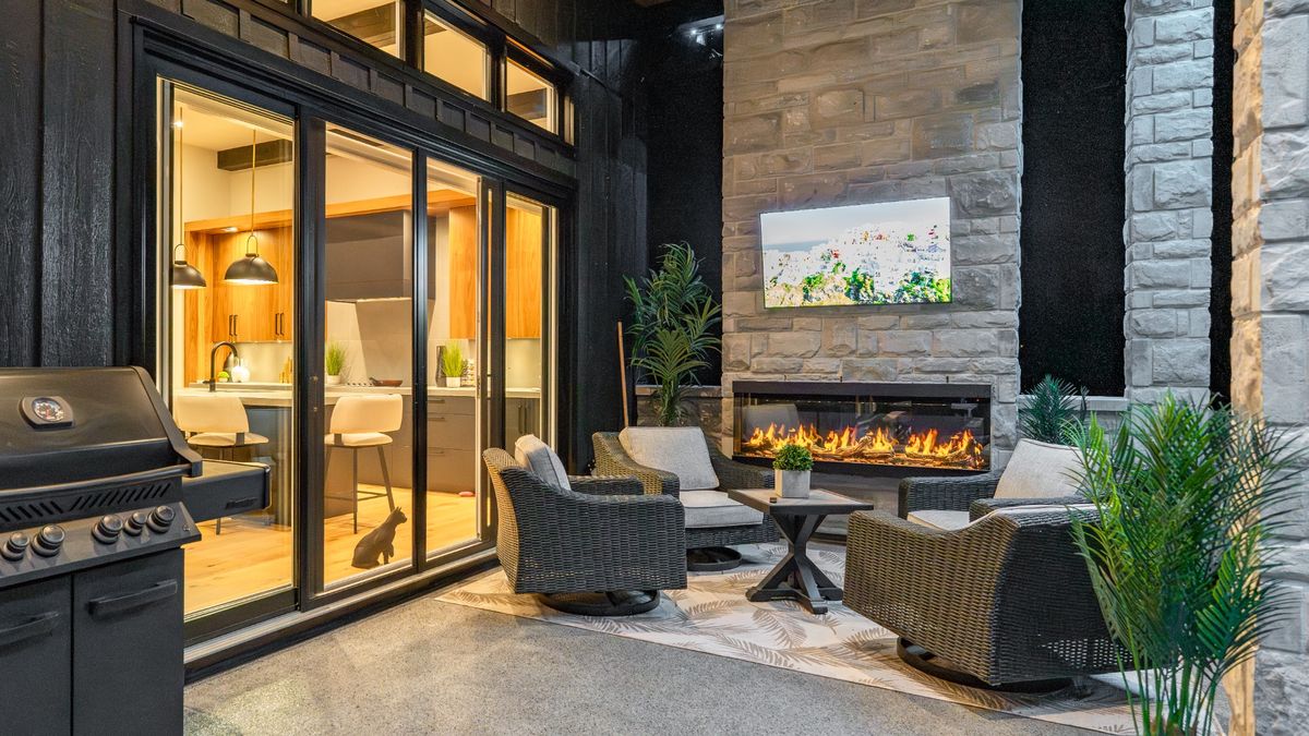 Outdoor living space with fireplace and seating